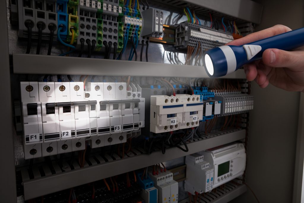 technician analyzing fusebox